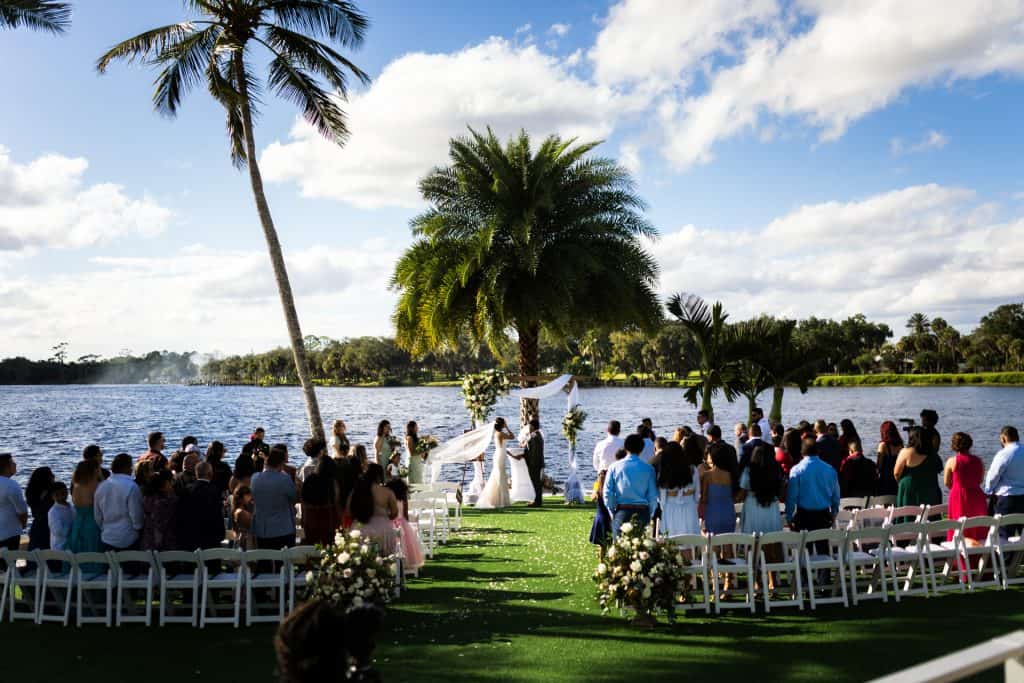 Bride and groom having their ceremony in an island outdoors.