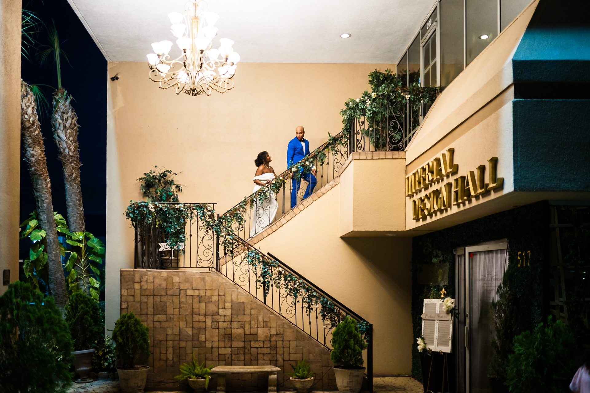 Bride and groom smiling and dancing in the middle of the dance floor outdoors.