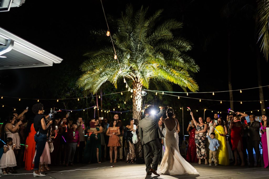 Groom spinning bride in the middle of the dance floor during their wedding's first dance.